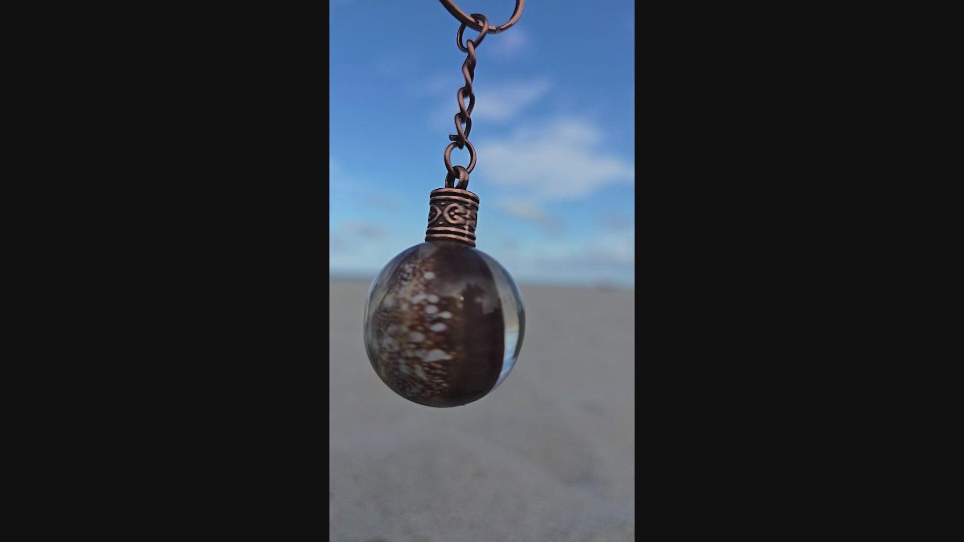 Brown cowrie shell resin orb keychain